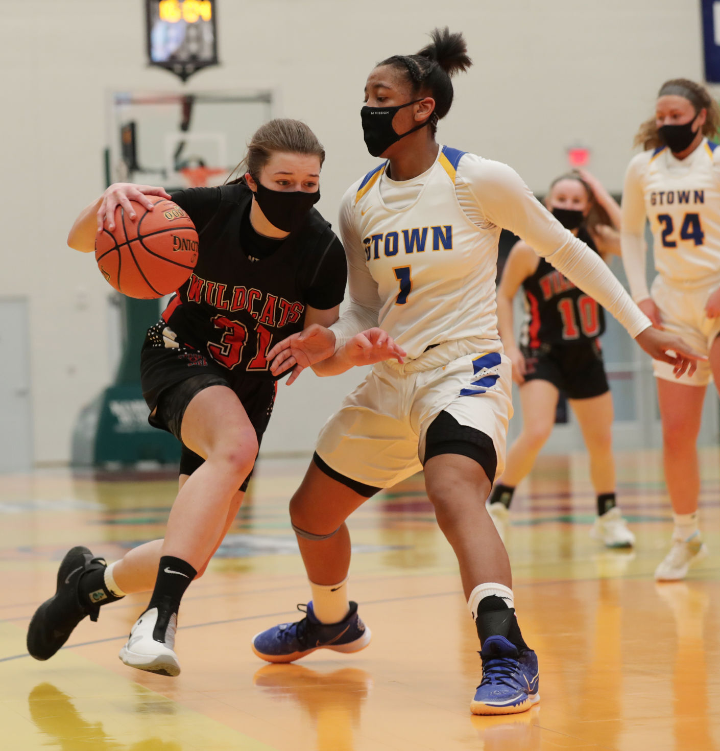 WIAA state girls basketball photo: Verona's Taylor Stremlow works against Germantown's KK Arnold